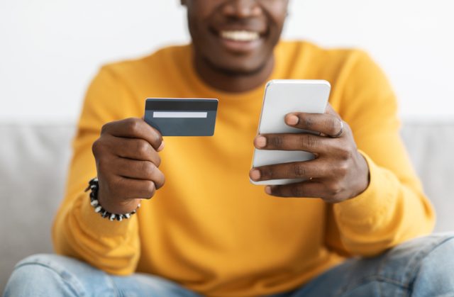 A man using his MBNA Platinum Credit Card